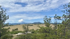 Looking Southwest across Greenland Open Space with Pikes Peak in the distance, Palmer Lake, Colorado. August 15, 2026.